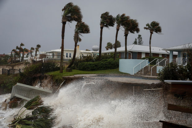 Waves crash into a beachfront house after Hurricane Nicole made landfall on Florida's east coast, in Daytona Beach Shores, Florida, U.S., November 10, 2022. REUTERS/Marco Bello