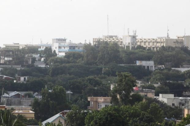 Gunfire was heard from inside a besieged hotel in the Somali capital while parliament said it had postponed a scheduled session.