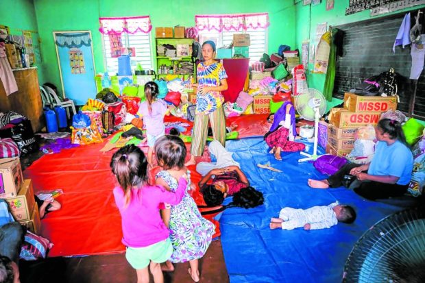 Some of the families forced to flee their homes due to the onslaught of Severe Tropical Storm “Paeng” (Nalgae) remain on Tuesday at Broce Central Elementary School of Peace in Datu Odin Sinsuat, Maguindanao province, where the majority of the storm fatalities have been confirmed. STORY: DSWD vows no more wasted relief goods