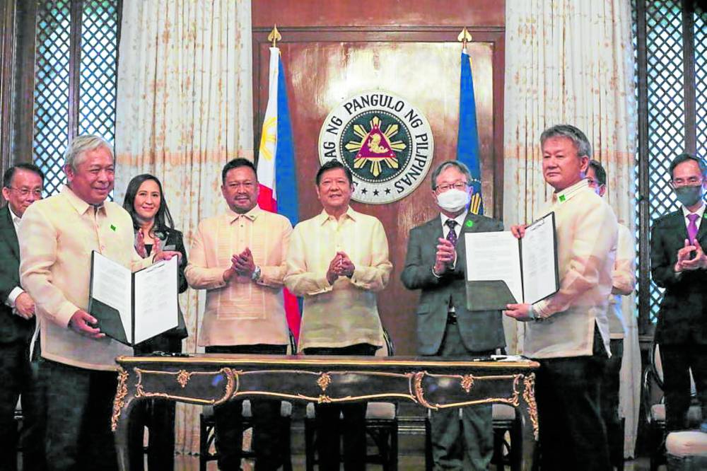 President Ferdinand Marcos Jr. and other officials witness on Thursday the contract signing for the construction of the Quezon Avenue and East Avenue stations and the Anonas and Camp Aguinaldo stations of the Metro Manila Subway Project.