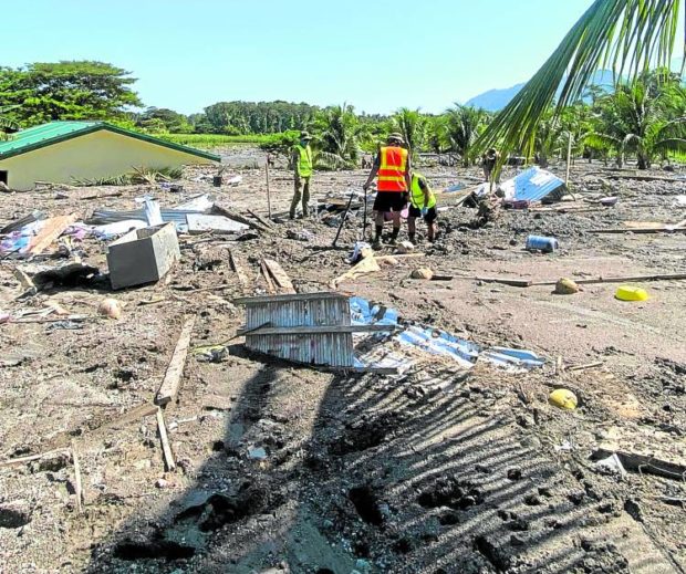 A search team tries to find more survivors in the landslide that buried the houses of the indigenous Teduray tribe in Barangay Kusiong, Datu Odin Sinsuat, Maguindanao del Norte