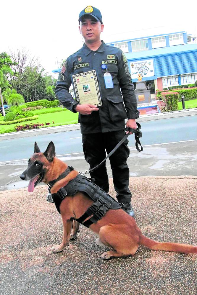 “Sky” with his former handler and now owner, Police Staff Sgt. Froilan Castillo