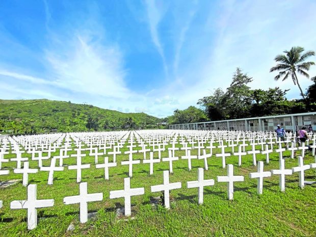 The more than 2,200 white crosses at a section of Holy Cross Cemetery in Tacloban City mark the final resting place of people who died during the onslaught of Supertyphoon “Yolanda” (Haiyan) on Nov. 8, 2013. 