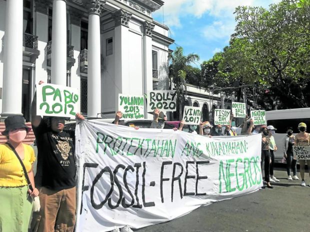 ADVOCACY Environment advocates reiterate their support for clean sources of energy during a protest staged outside the Negros Occidental provincial capitol in Bacolod City during the celebration of Earth Day in April this year.