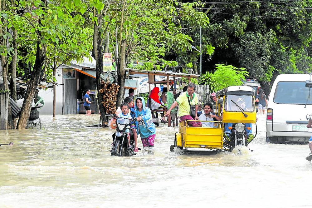 The streets of Malalag, Davao del Sur, are flooded on Thursday due to heavy rains 