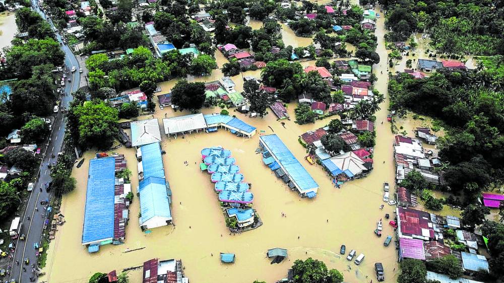 Heavy rains since Wednesday night caused the rivers in Malalag, Davao del Sur, to swell, swamping its town center and 10 other villages with floodwaters