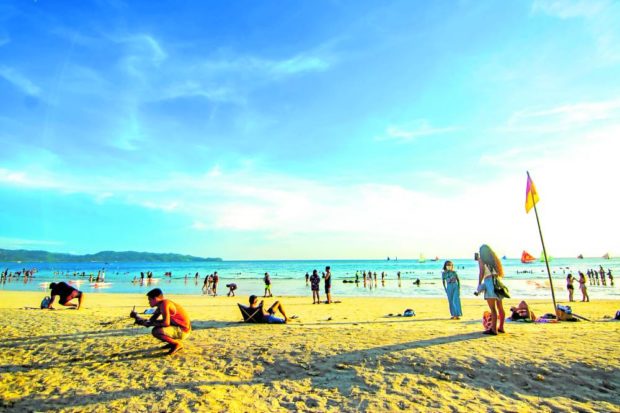 ONCE AGAIN THE LEISURE DESTINATION Tourists take their spots on the beaches of Boracay Island in this June 2022 photo. —IAN PAUL CORDERO/CONTRIBUTOR
