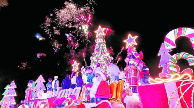The well-lit and colorful Christmas village setup on the shore of Sumlang Lake in Camalig, Albay, brings joy to tourists during its opening on Thursday to signal the return of tourism activities in the town. STORY: Candy factory-themed Christmas village lights up Albay lake, creates jobs