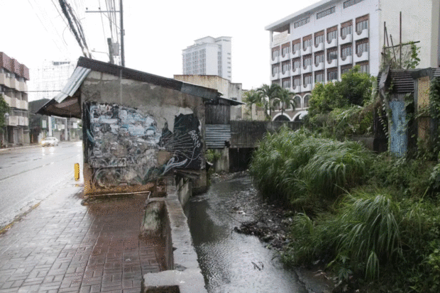 WATERWAY CLEARING   Structures that encroach on the Lahug-Kamputhaw-Tejero waterway in Cebu City have been ordered demolished by the local government, including this concrete shed in this photo taken on Nov. 25, in a bid to address the city’s flood problem. —PHOTO COURTESY OF CEBU CITY INFORMATION OFFICE