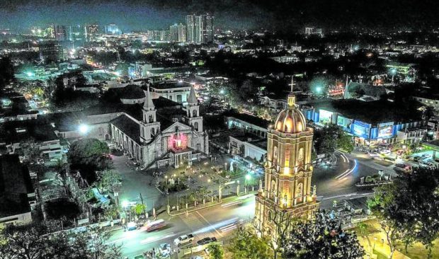 RELIGIOUS LANDMARK   The newly restored Jaro belfry towering at Graciano Lopez Jaena Plaza stands across Jaro Cathedral in Iloilo City in this photo taken last week. —PHOTO COURTESY OF ILOILO CITY MAYOR JERRY TREÑAS
