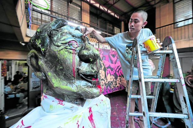 An effigy is being prepared for a protest rally to mark Bonifacio Day, which labor groups are expected to join. STORY: Labor groups seek pay hike of P100 per day