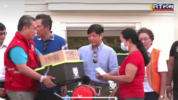 President Ferdinand "Bongbong" Marcos Jr. leads the distribution of government aid to residents of Antique who were affected by tropical storm Paeng