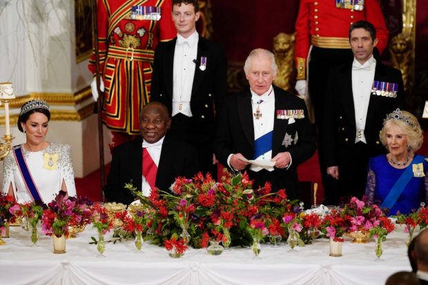 Britain's Catherine, Princess of Wales (L), South Africa's President Cyril Ramaphosa (2L), and Britain's Camilla, Queen Consort (R) listen as Britain's King Charles III speaks during a State Banquet at Buckingham Palace in London on November 22, 2022, at the start of the President's of South Africa's two-day state visit. - King Charles III hosted his first state visit as monarch on Tuesday, welcoming South Africa's President to Buckingham Palace. (Photo by Aaron Chown / POOL / AFP)