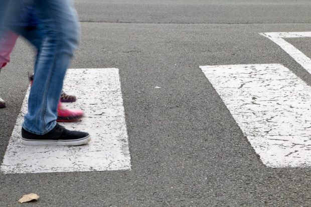 Stock photo, closse up of legs of people walking on zebra crossing. STORY: Gov’t urged to make streets safer for kids