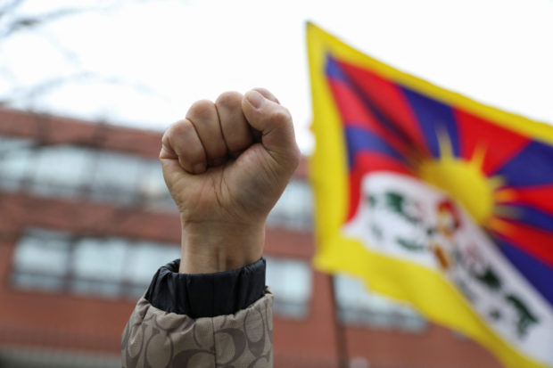 People protest in solidarity over COVID-19 restrictions in mainland China, in Toronto