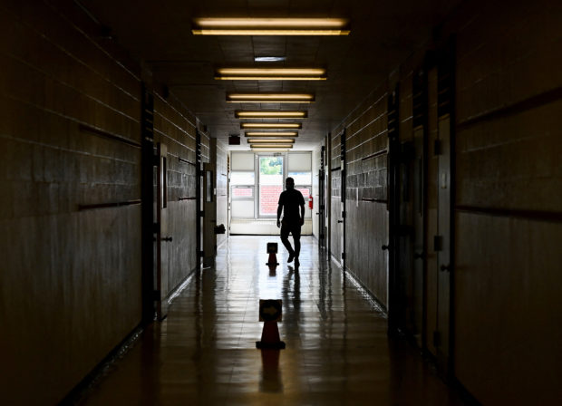 FILE PHOTO: A teacher walks the divided hallways at Hunter's Glen Junior Public School in Scarborough