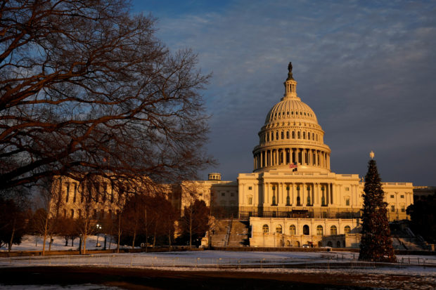 FILE PHOTO: The U.S. Capitol is seen at sunset on the eve of the first anniversary of the January 6, 2021 attack on the building, on Capitol Hill in Washington