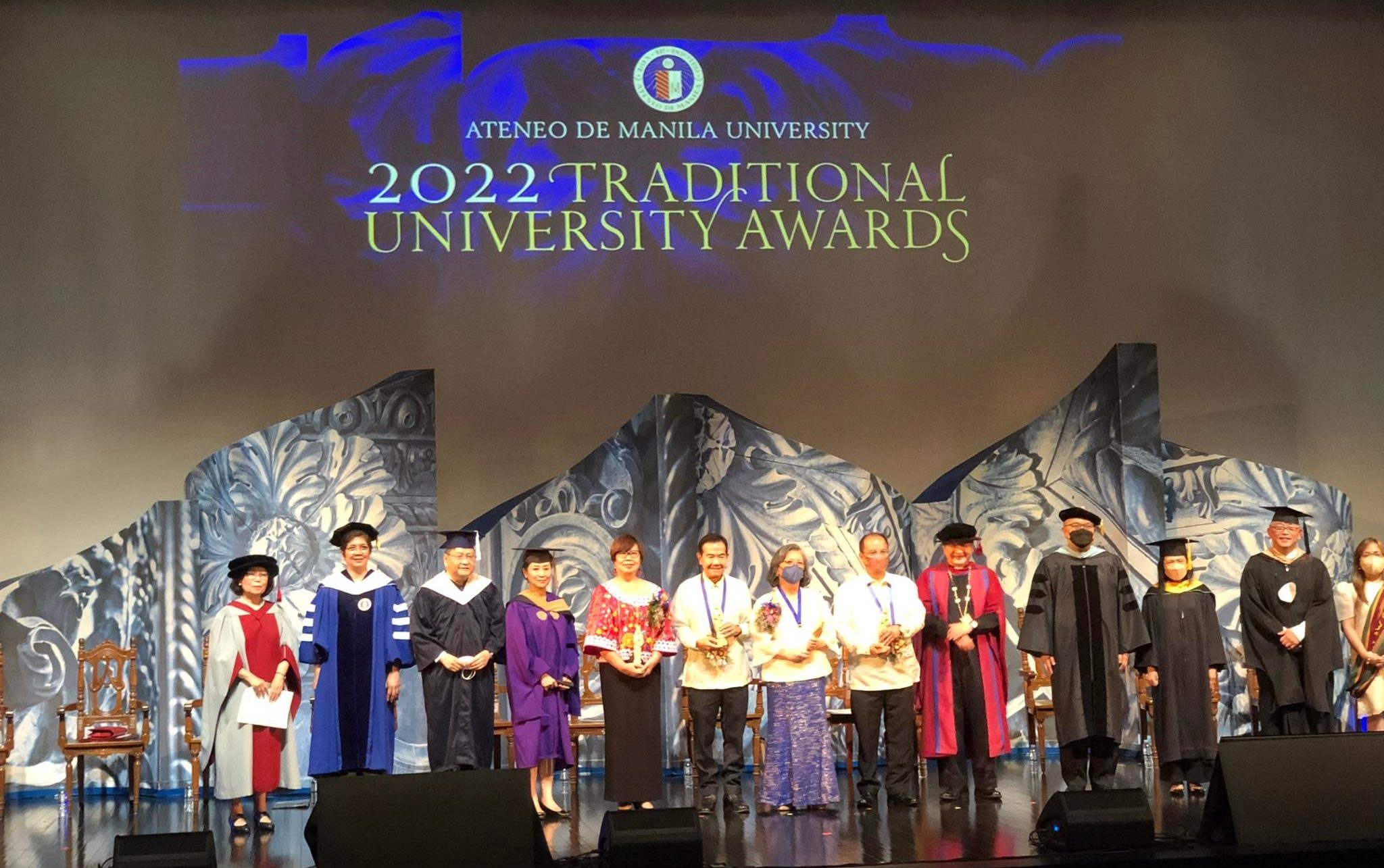 Millie Kilayko (5th from left), president of the Negrense Volunteers for Change (NVC), receives the award at Ateneo de Manila University
