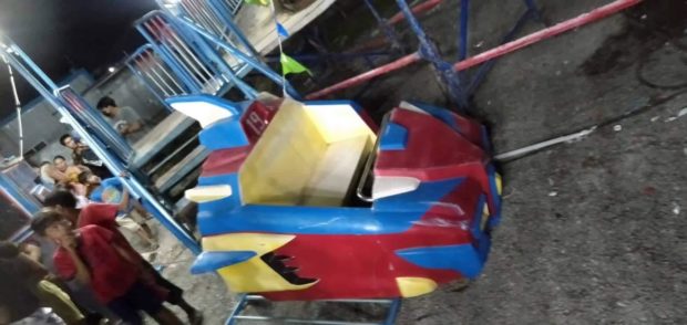 This seat from a caterpillar ride broke down, causing three people, including a 2-year-old boy, to fall to the ground and sustain serious injuries. (Photo courtesy of Masinloc police)