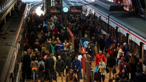 Passengers at a train station in Spain. STORY: Spain to test cut in work hours to boost productivity