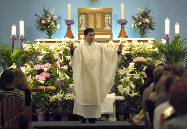 FILE PHOTO: Father Frank Anthony Pavone, the dedicated National Director of Priests for Life from New York, gives a Homily during a funeral Mass in Gulfport, Florida April 5, 2005. . REUTERS/Jim Stem  JMS