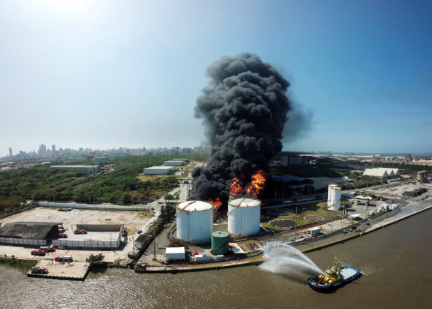 A fuel tank exploded into flames in Colombia's Caribbean city of Barranquilla early on Wednesday, killing a firefighter.