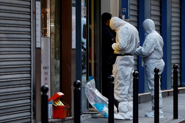 French scientific police work at site of shooting of Kurdish people in Paris. STORY: Paris shooting suspect expressed ‘hatred of foreigners,’ says prosecutor