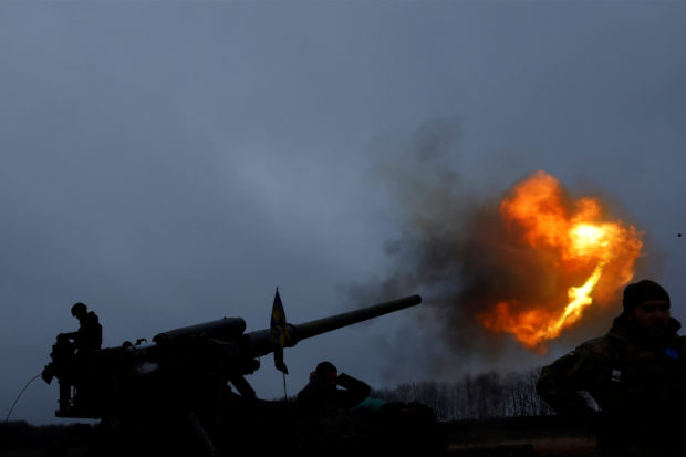 Ukrainian soldiers with the 43rd Heavy Artillery Brigade fire a projectile from a 2S7 Pion self propelled cannon, as Russia's attack on Ukraine continues, during intense shelling on the front line in Bakhmut, Ukraine, December 26, 2022. REUTERS/Clodagh Kilcoyne