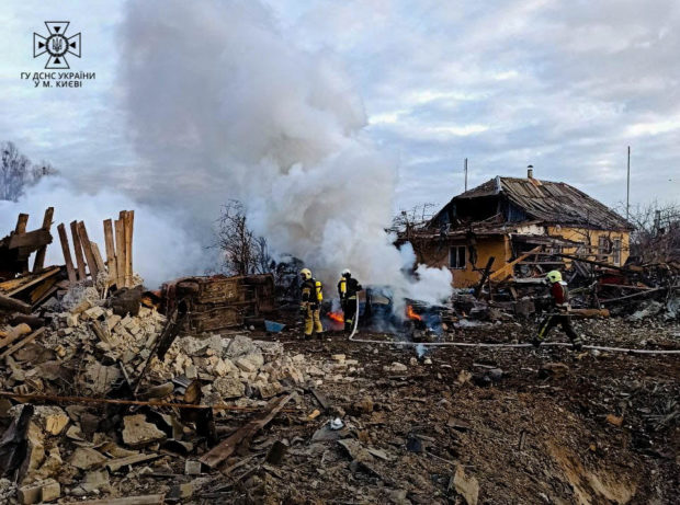Rescuers work at a site of private houses heavily damaged by a Russian missile strike, amid Russia's attack on Ukraine, in Kyiv, Ukraine, in this handout picture released December 29, 2022. Press service of the State Emergency Service of Ukraine/Handout via REUTERS