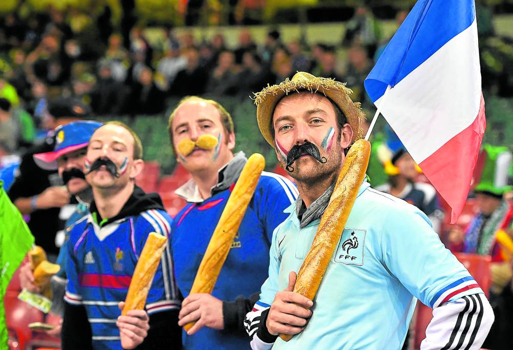 French rugby fans brandish baguettes ahead of a Rugby World Cup match in Cardiff, south Wales, in this October 2015 file photo