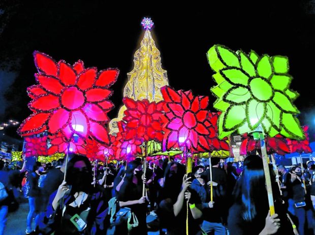 Over a thousand students and faculty members of Saint Louis University in Baguio City return to downtown Session Road carrying colorful lanterns to launch the Christmas season in Baguio on Dec. 1. The annual holiday event was suspended in 2020 and 2021 due to the COVID-19 pandemic. STORY: Lantern fest ushers back parades in Baguio