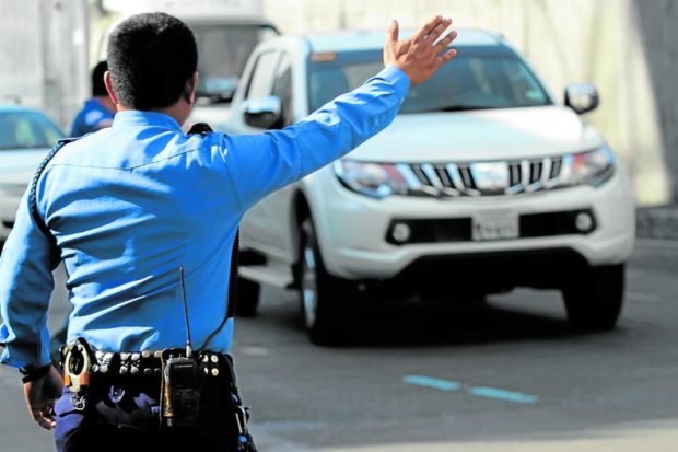 Metro Manila traffic enforcers at work. STORY: Metro Manila mayors OK single ticket system