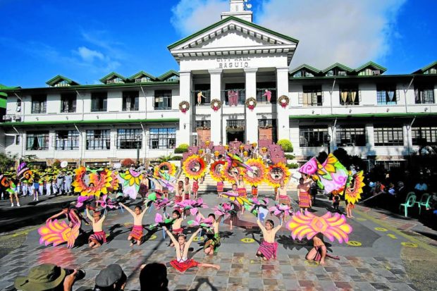 Students garbed in Cordillera attire and with flower-themed props perform a street dance in front of the Baguio City Hall on Monday as a preview to the main event for the tourist-drawing Panagbenga or Baguio Flower Festival that will be restaged in-person in late February next year. STORY: Baguio ready for full comeback