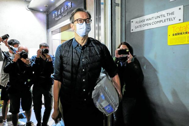 Former Stand News editor-in-chief Chung Pui-kuen leaves the court after release on bail over his charge of conspiring to publish "Seditious Publications" in Hong Kong, December 13, 2022. REUTERS/Tyrone Siu
