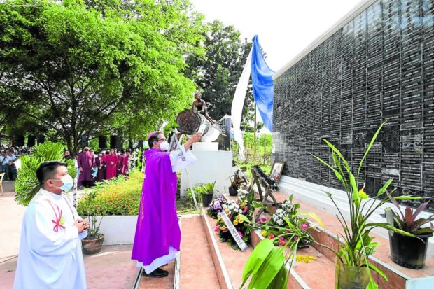 Iligan Bishop Jose Ramirez Rapadas III officiating Mass in memory of Sendong victims. STORY: Iligan’s Sendong survivor: Trauma still haunts us