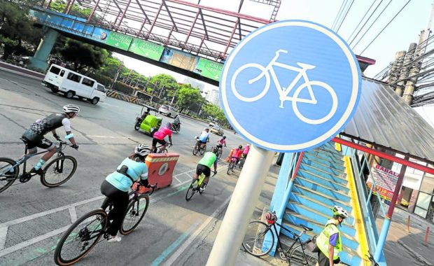 Bikers on a bike line in Quezon City. STORY: DOTr plan: Pedestrians, bikers get top priority