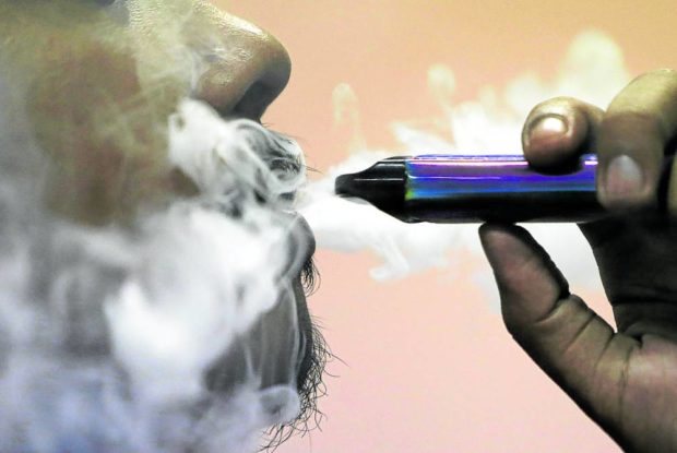 Closeup of man vaping. STORY: Vapers in indoor public spaces face fine of P5,000 to P20,000