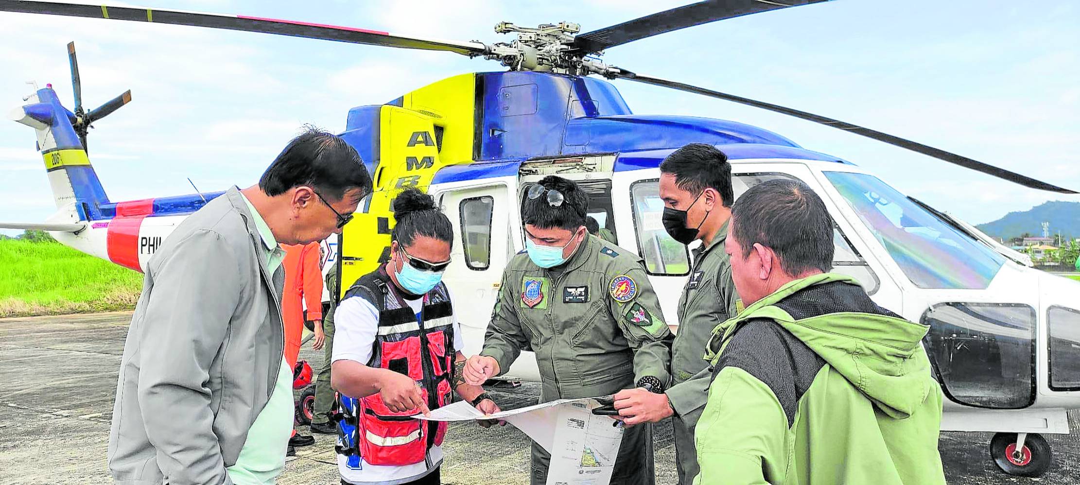 Rescue workers prepare to scour the waters off Catanduanes province and nearby areas on Monday with the help of the Philippine Air Force to find the eight fishermen who remained missing at sea.