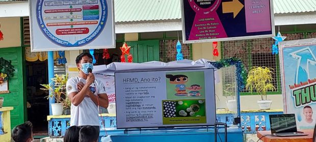 Healthcare workers conduct an information drive about hand, foot and mouth disease to prevent its spread among pupils in an elementary school in La Union province. (Photo from Facebook page of Ambitacay Elementary School Agoo La Union)
