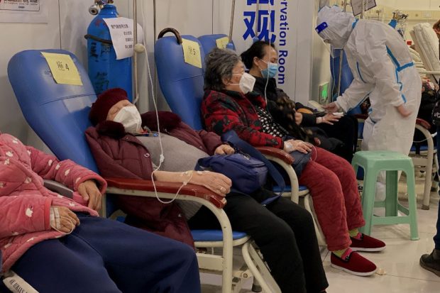 Covid-19 coronavirus patients rest in the Second Affiliated Hospital of Chongqing Medical University in China's southwestern city of Chongqing on December 23, 2022. (Photo by Noel CELIS / AFP)