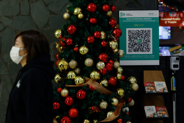 A QR code for the "LeaveHomeSafe" COVID-19 contact-tracing app is seen inside a shopping mall in Hong Kong