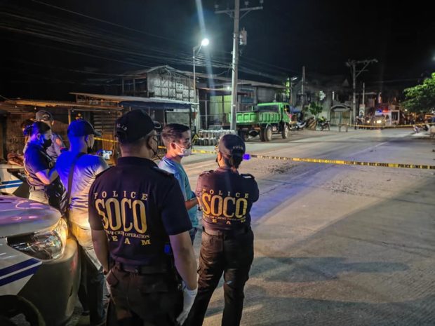 Police scene of the crime operatives conduct post crime investigation at the site where a BAMM IP official was gunned down in Cotabato City on Tuesday night. (Photo by Ferdinandh Cabrera)