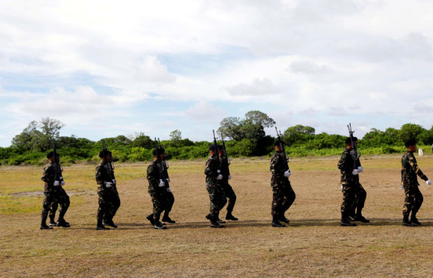 FILE PHOTO: Filipino soldiers march in Thitu island