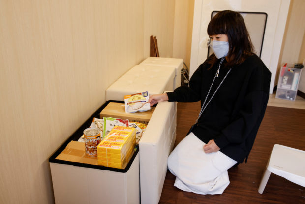 Megumi Morohoshi, a Japanese mother of three, displays the stores of emergency food inside her family's newly installed bomb shelter in Saitama