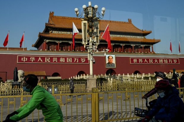 The national flags of the Philippines and China are seen together near the Tiananmen Gate as Philippine President Ferdinand Marcos Jr visits, in Beijing on January 3, 2023. (Photo by Noel CELIS / AFP)
