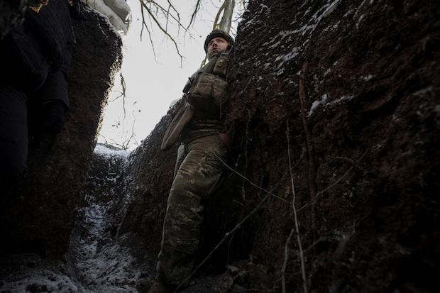 A Ukrainian serviceman is seen in a trench at a frontline in Donetsk region. STORY: No sign of casualties at site of Russian rocket strike in Ukraine