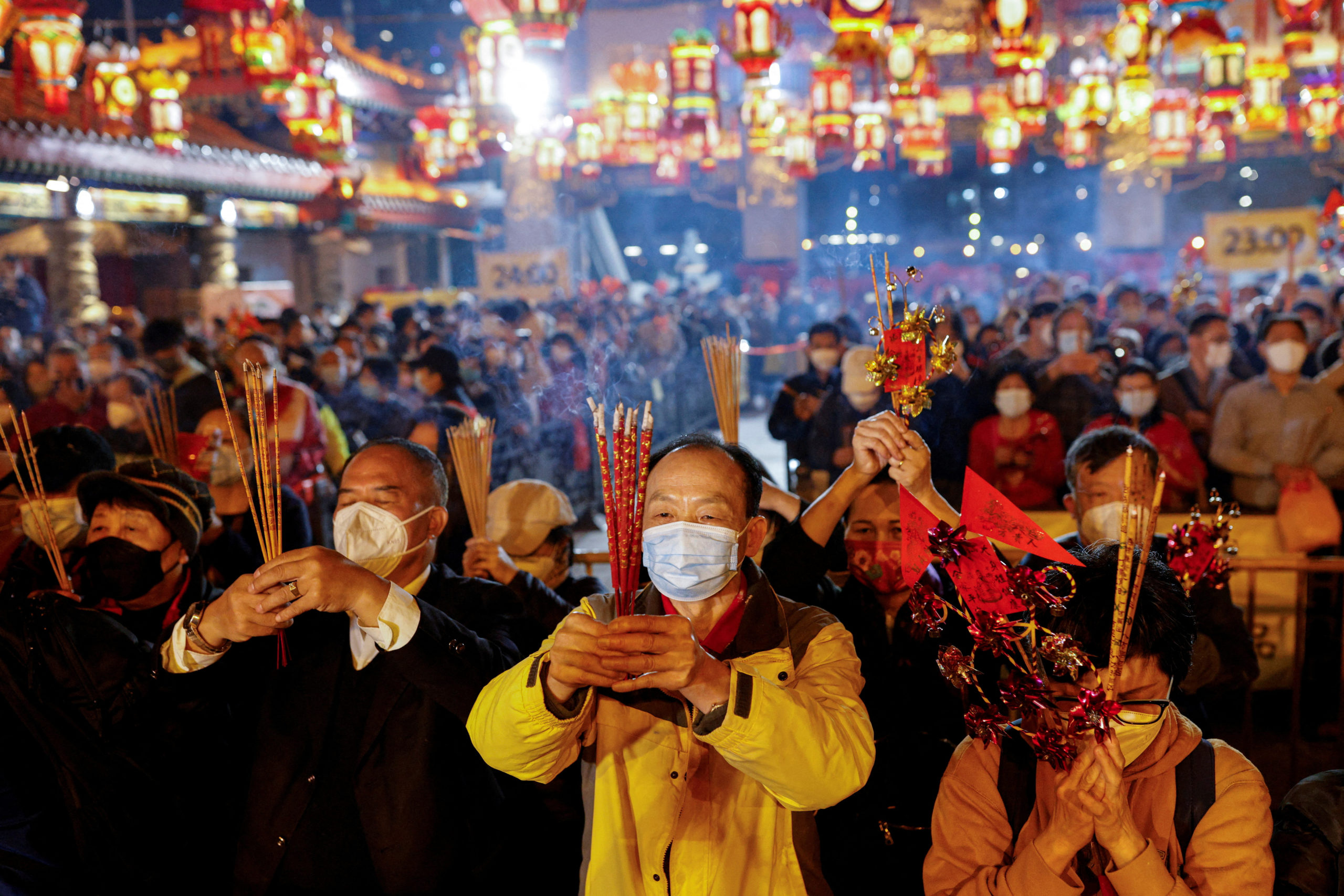 Chinese make offerings at Wong Tai Sin Temple to welcome the Lunar New Year.