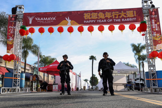 Police officers guard the area near the location of a shooting that took place during a Chinese Lunar New Year celebration, in Monterey Park, California, US on Jan. 22, 2023. STORY: Elderly Fil-Am among 10 dead in US shooting