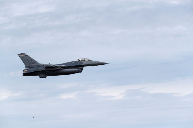 FILE PHOTO: U.S. Air Force F-16 Fighting Falcon from the 140th Wing of the Colorado Air National Guard during NATO exercise Saber Strike flies over Amari military air base, Estonia June 12, 2018. REUTERS/Ints Kalnins Ukraine Biden
