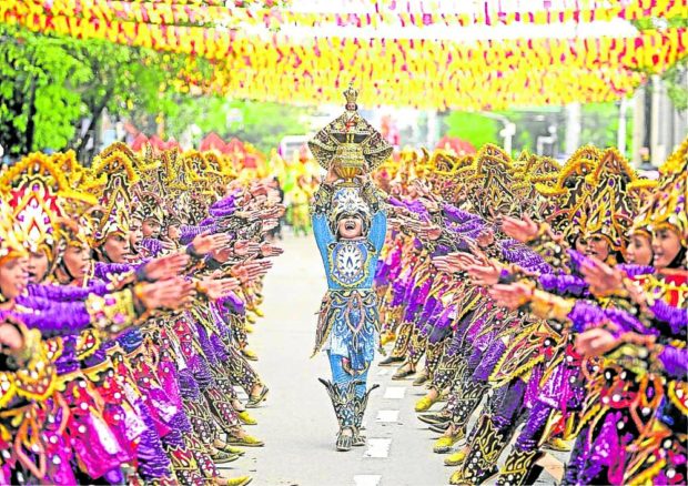 SINULOG STAR A dance contingent joins the Sinulog grand parade in this 2019 photo. The Señor Sto. Niño de Cebu, the representation of the Holy Child Jesus, is the star of the Sinulog festivities that Cebu City is celebrating every January. —PHOTO COURTESY OF CEBU DAILY NEWS